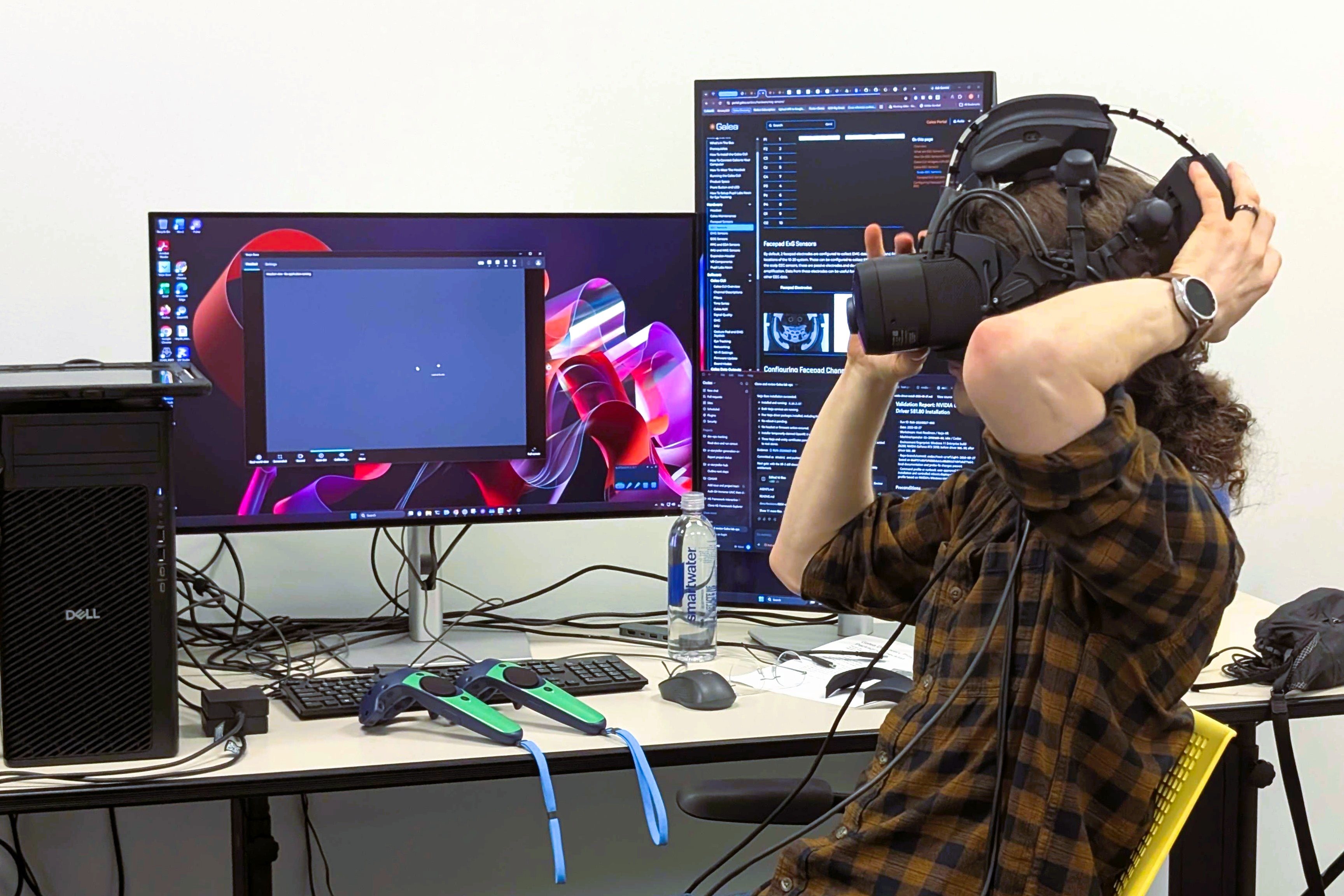 Photo Credit:&nbsp;J. Planey, Siebel School of Computing and Data Science  J. Metz, IMMERSE Assistant Director for Infrastructure, testing the OpenBCI Galea device in the IMMERSE lab.